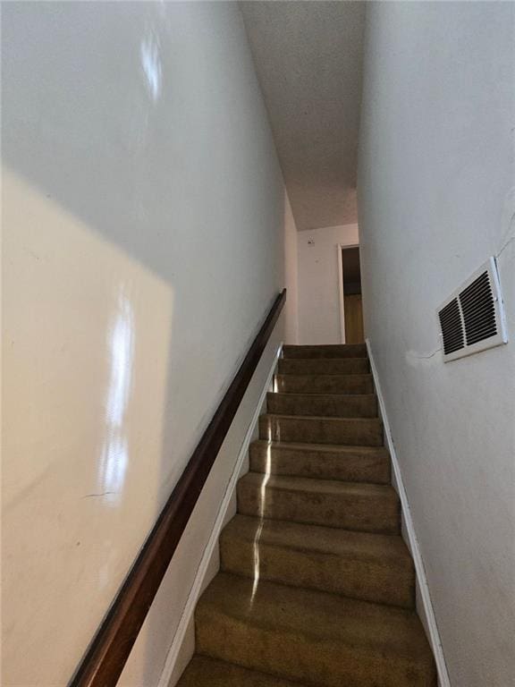 1297 Tree Creek Ct, Clarkston, GA 30021 - stairway with baseboards