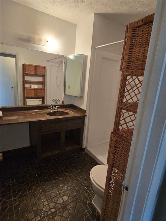 1297 Tree Creek Ct, Clarkston, GA 30021 - bathroom with a shower, vanity, and a textured ceiling