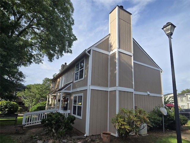1297 Tree Creek Ct, Clarkston, GA 30021 - view of side of property with a chimney