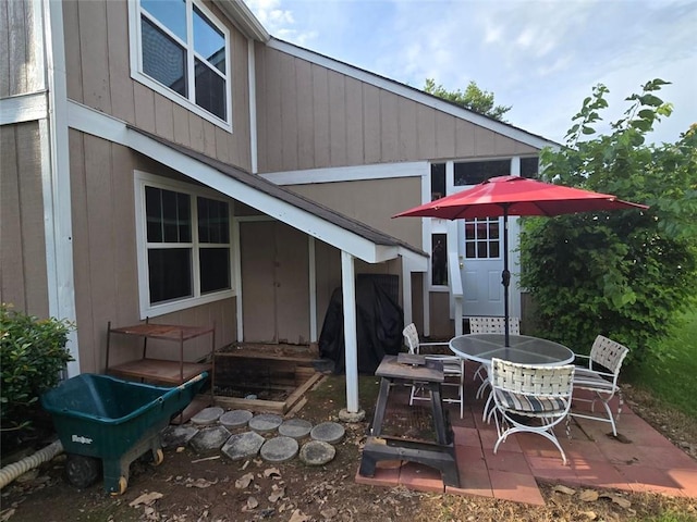 1297 Tree Creek Ct, Clarkston, GA 30021 - back of property featuring outdoor dining area and a patio