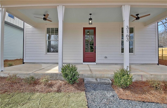 property entrance featuring covered porch and ceiling fan