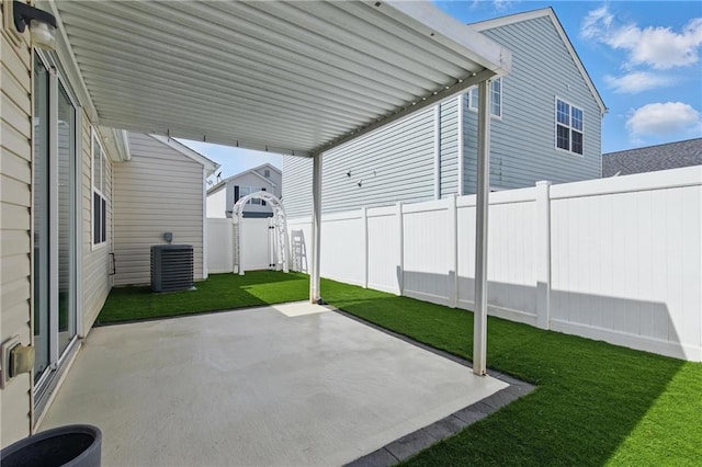 view of patio with central AC unit and a fenced backyard