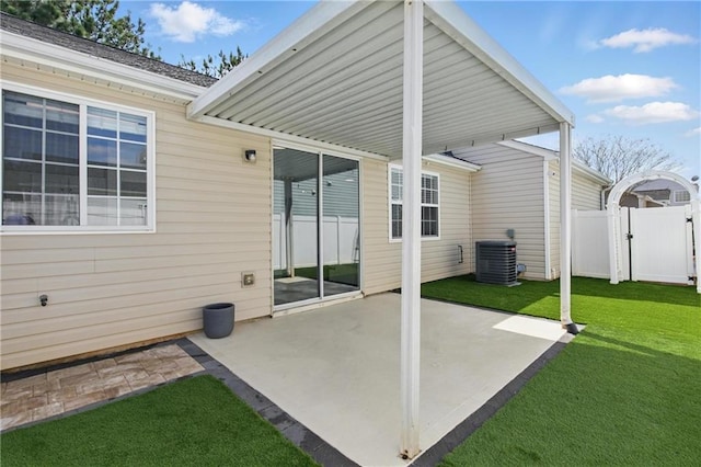 view of patio / terrace featuring central air condition unit, fence, and a gate