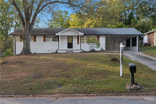 ranch-style home with a front lawn, driveway, crawl space, a carport, and brick siding