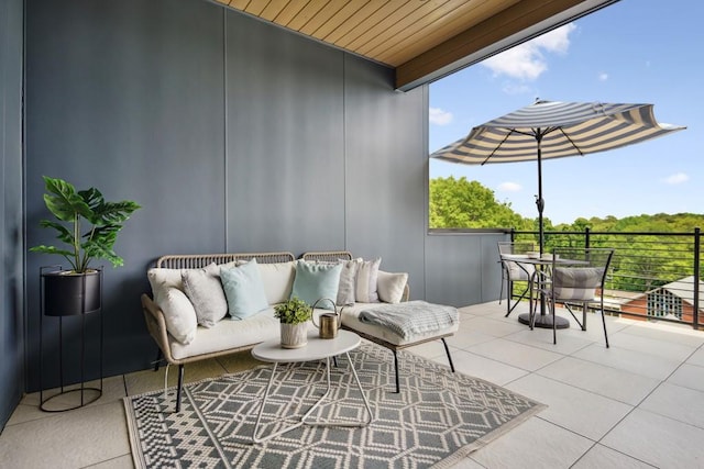 view of patio featuring an outdoor living space and a balcony