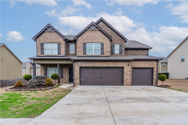 craftsman-style home featuring brick siding and driveway