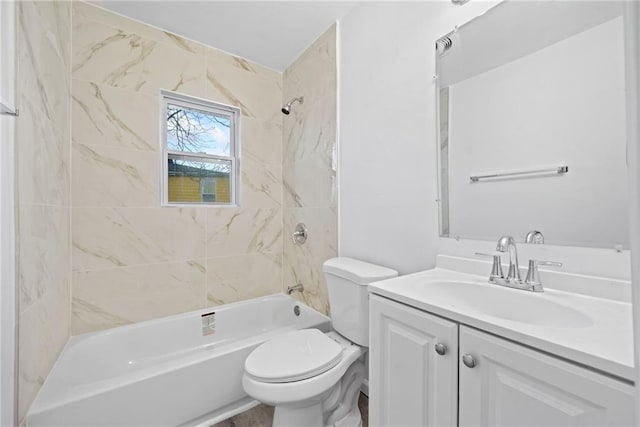 full bathroom featuring toilet, vanity, and tiled shower / bath