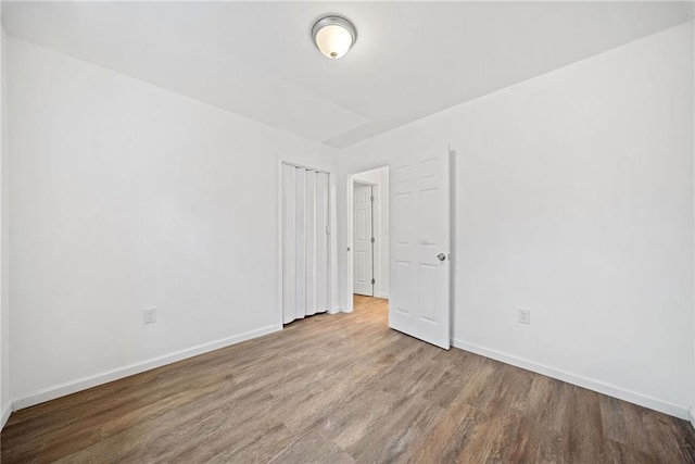 empty room featuring hardwood / wood-style flooring