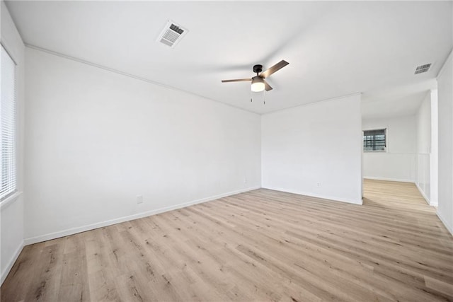 spare room with ceiling fan and light hardwood / wood-style floors