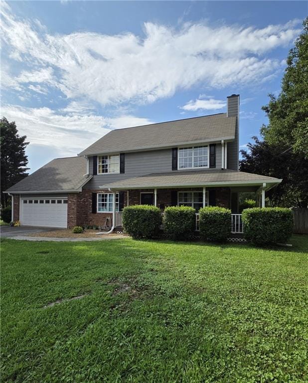 77 Ben W Dr, Cedartown, GA 30125 - view of front of property with a chimney, a garage, a front yard, and driveway