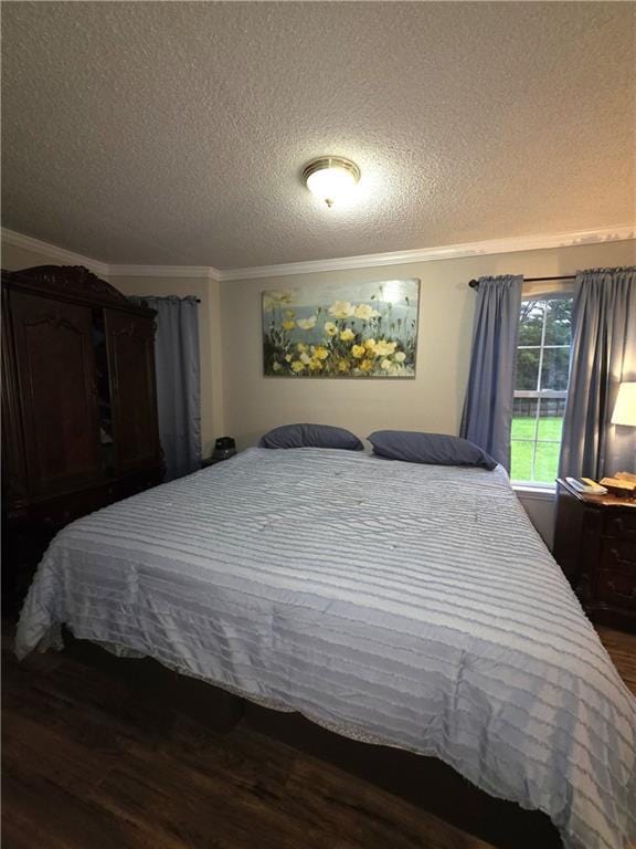 77 Ben W Dr, Cedartown, GA 30125 - bedroom featuring dark wood finished floors, ornamental molding, and a textured ceiling