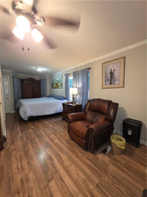 77 Ben W Dr, Cedartown, GA 30125 - bedroom featuring crown molding, dark wood-type flooring, a ceiling fan, and a textured ceiling