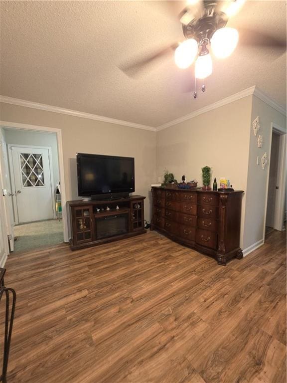 77 Ben W Dr, Cedartown, GA 30125 - living area with wood finished floors, a textured ceiling, a ceiling fan, and ornamental molding