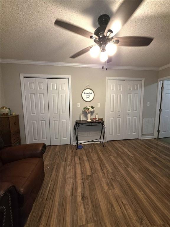 77 Ben W Dr, Cedartown, GA 30125 - living area with ceiling fan, a textured ceiling, dark wood finished floors, and ornamental molding