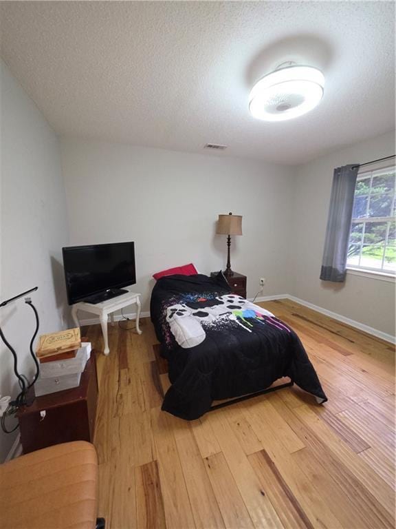 77 Ben W Dr, Cedartown, GA 30125 - bedroom featuring light wood-style floors and a textured ceiling