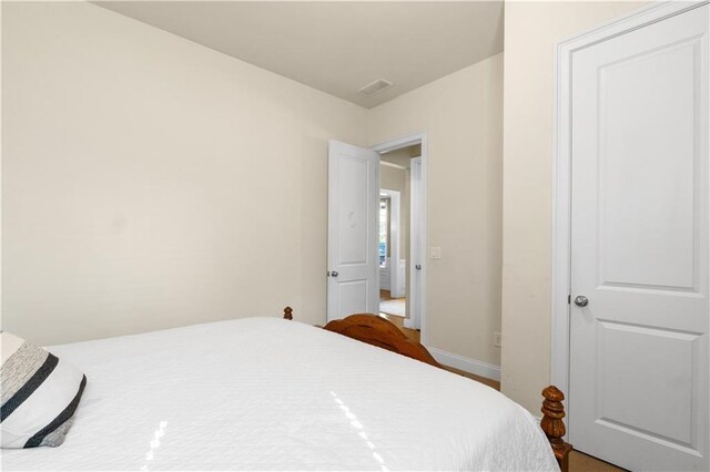 bedroom featuring baseboards