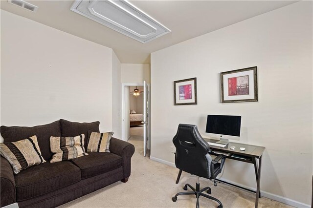 office area featuring light colored carpet, attic access, baseboards, and visible vents
