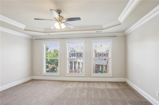 345 Alderwood Ln, Sandy Springs, GA 30328 - spare room featuring a tray ceiling, crown molding, light carpet, a ceiling fan, and baseboards