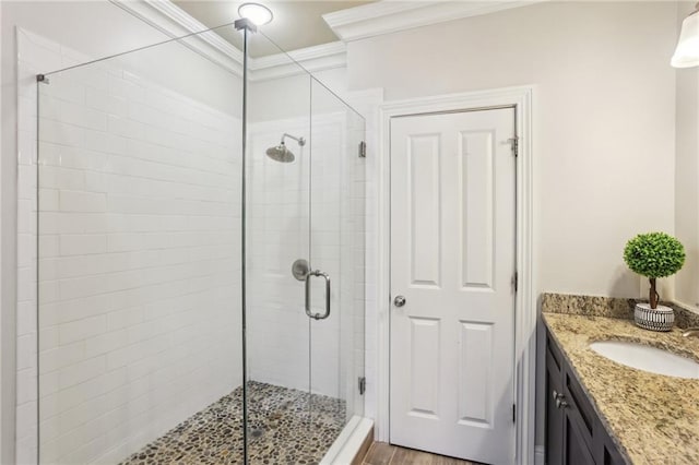 345 Alderwood Ln, Sandy Springs, GA 30328 - bathroom featuring ornamental molding, a shower stall, vanity, and wood finished floors