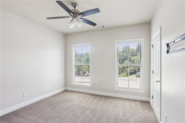 345 Alderwood Ln, Sandy Springs, GA 30328 - spare room with light colored carpet, baseboards, and a ceiling fan