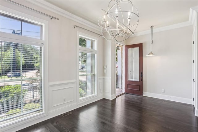 345 Alderwood Ln, Sandy Springs, GA 30328 - foyer featuring a chandelier, crown molding, dark wood-style floors, a wainscoted wall, and a decorative wall