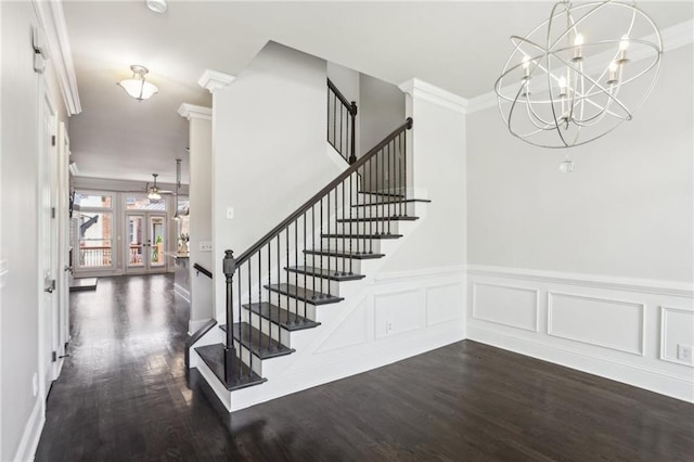 345 Alderwood Ln, Sandy Springs, GA 30328 - staircase with wood finished floors, crown molding, a chandelier, wainscoting, and french doors