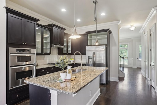 345 Alderwood Ln, Sandy Springs, GA 30328 - kitchen featuring a sink, stainless steel appliances, backsplash, dark wood finished floors, and baseboards