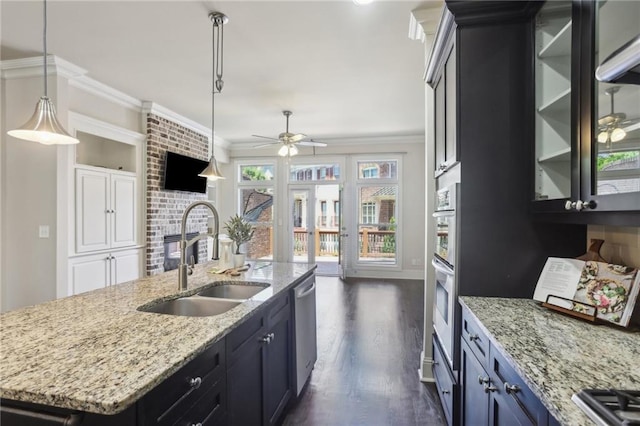 345 Alderwood Ln, Sandy Springs, GA 30328 - kitchen with a sink, ornamental molding, a ceiling fan, dark wood finished floors, and glass insert cabinets