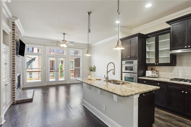 345 Alderwood Ln, Sandy Springs, GA 30328 - kitchen with a sink, french doors, stainless steel appliances, tasteful backsplash, and glass insert cabinets