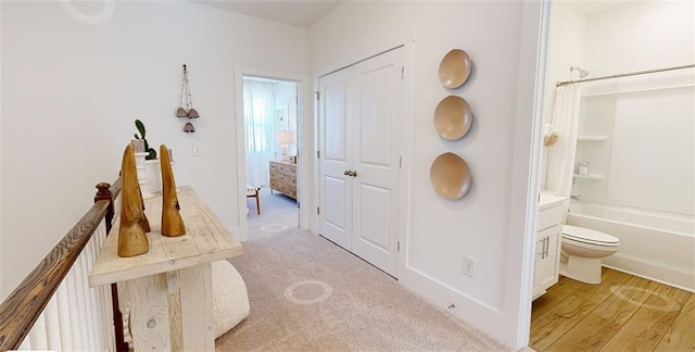 hallway with light carpet