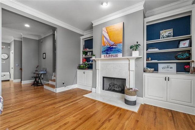 1912 Hosea L Williams Dr NE Unit 1, Atlanta, GA 30317 - living area featuring light wood-style flooring, baseboards, crown molding, a premium fireplace, and recessed lighting