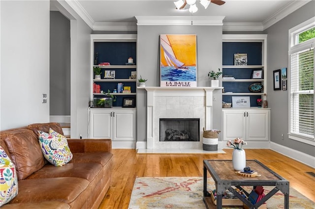 1912 Hosea L Williams Dr NE Unit 1, Atlanta, GA 30317 - living room with wood finished floors, a ceiling fan, a fireplace, ornamental molding, and baseboards
