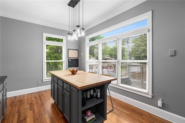 1912 Hosea L Williams Dr NE Unit 1, Atlanta, GA 30317 - dining area with crown molding, baseboards, wood finished floors, and a chandelier