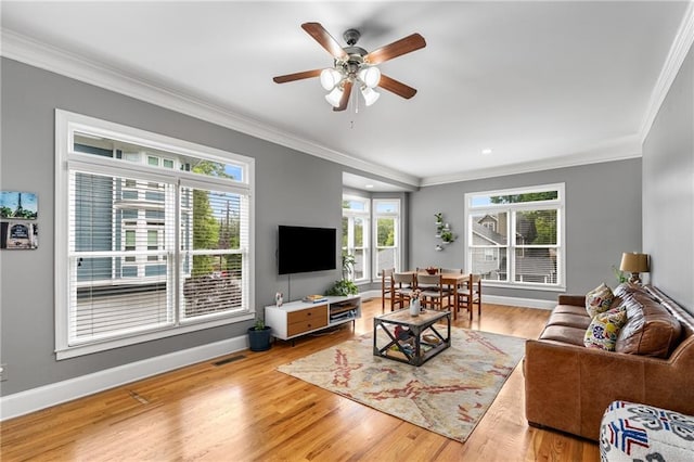 1912 Hosea L Williams Dr NE Unit 1, Atlanta, GA 30317 - living room featuring crown molding, a ceiling fan, baseboards, and wood finished floors