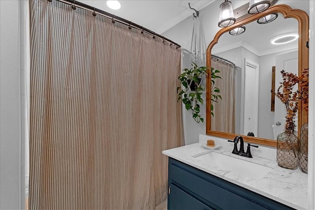 bathroom with ornamental molding, walk in shower, and vanity