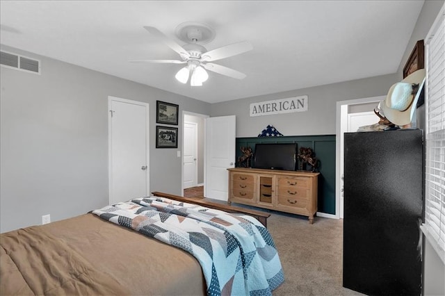 carpeted bedroom featuring ceiling fan