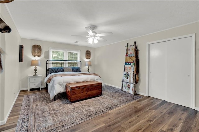 bedroom with ceiling fan and hardwood / wood-style floors