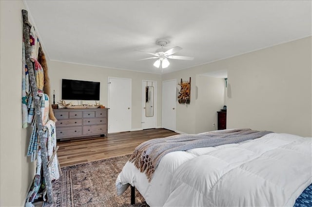 bedroom featuring ceiling fan and dark hardwood / wood-style flooring