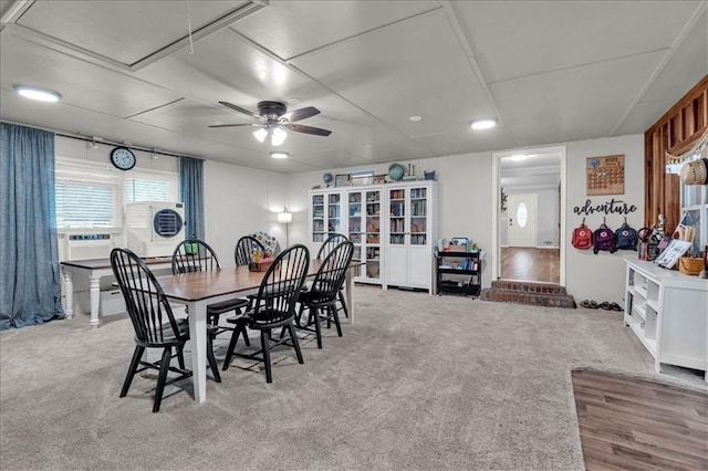 dining area featuring light carpet and cooling unit