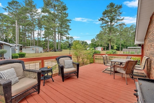 deck with a lawn and a shed