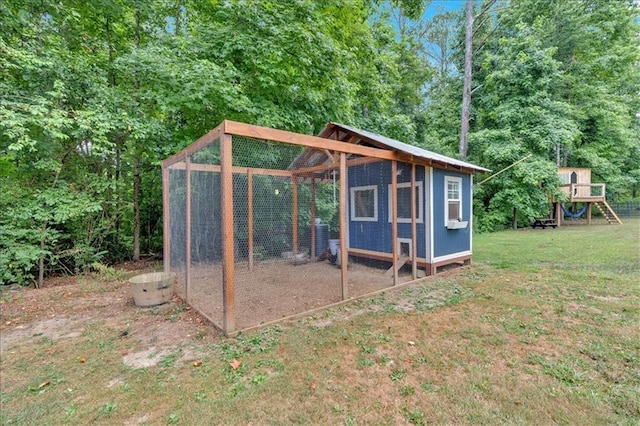 view of outbuilding with a yard