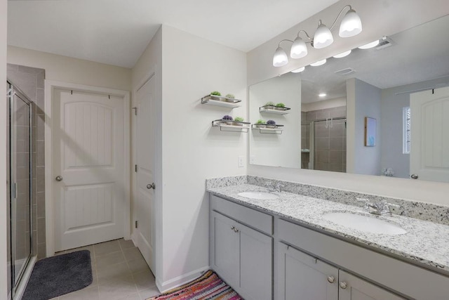 6721 Moondancer Ct, Flowery Branch, GA 30542 - bathroom featuring a stall shower, tile patterned flooring, double vanity, and baseboards