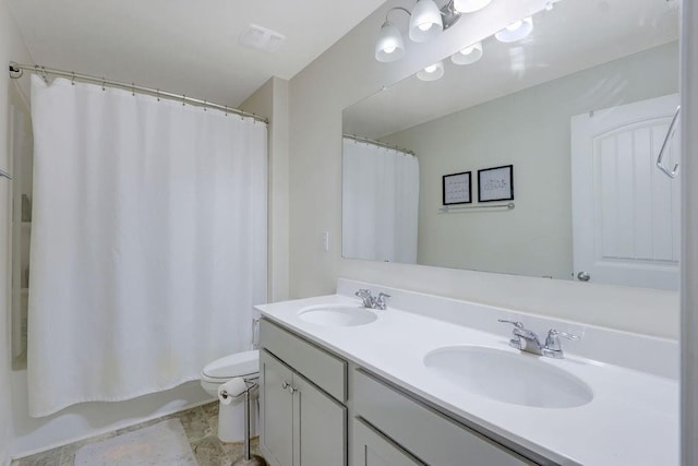 6721 Moondancer Ct, Flowery Branch, GA 30542 - bathroom featuring double vanity and toilet