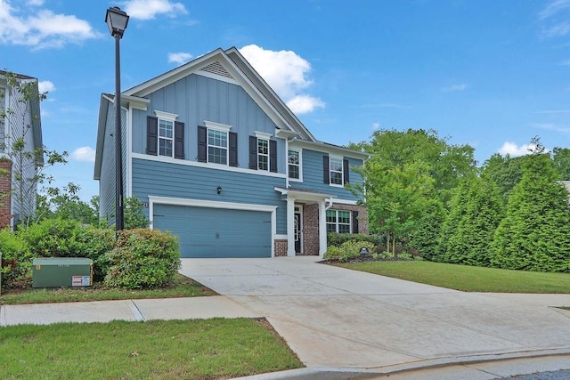 6721 Moondancer Ct, Flowery Branch, GA 30542 - traditional home with board and batten siding, a garage, driveway, and brick siding