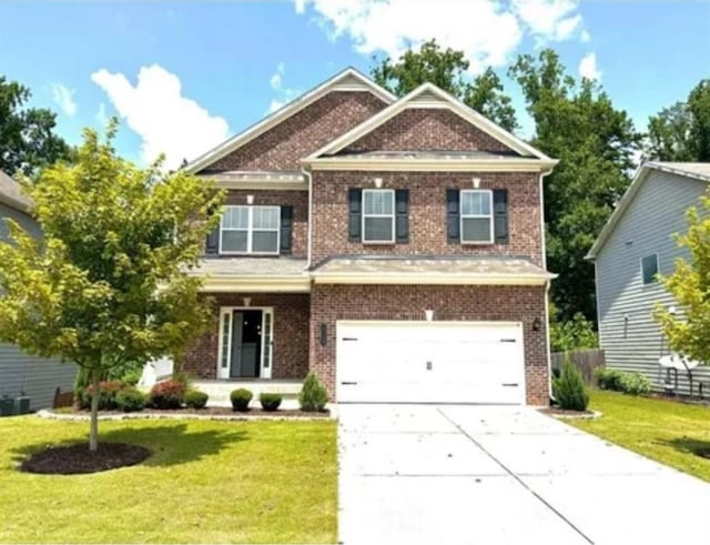 craftsman-style home with a garage and a front lawn