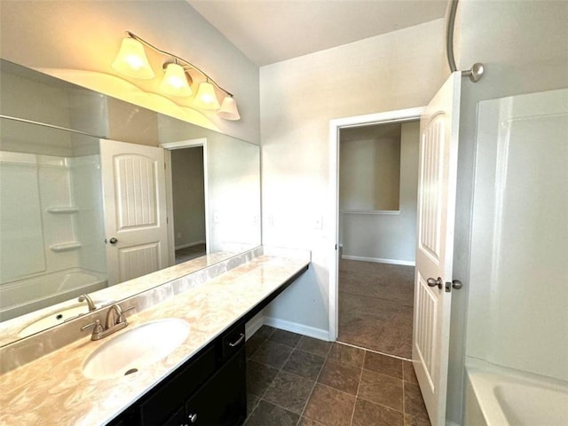 bathroom featuring shower / tub combination and vanity