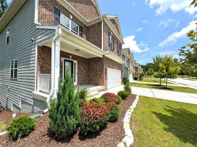 view of property exterior with a yard and a garage