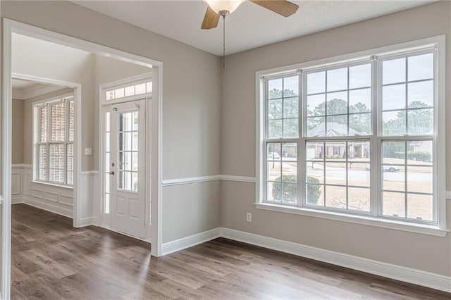 doorway featuring dark hardwood / wood-style floors and ceiling fan