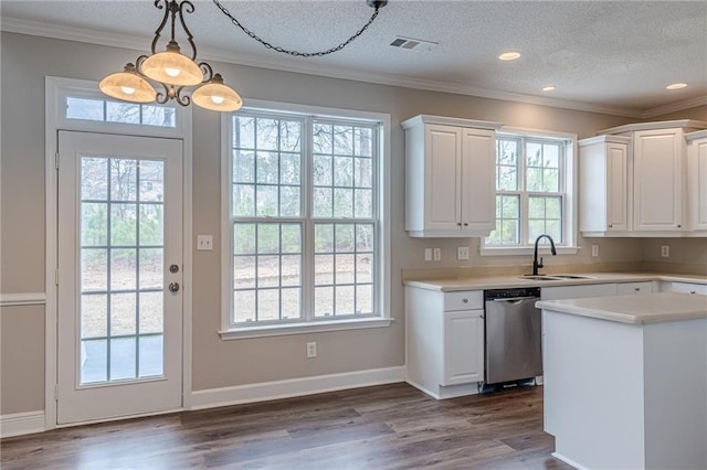 kitchen with sink, white cabinetry, hanging light fixtures, dark hardwood / wood-style flooring, and stainless steel dishwasher