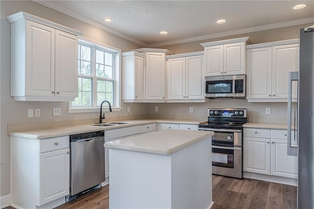 kitchen with sink, stainless steel appliances, and white cabinets